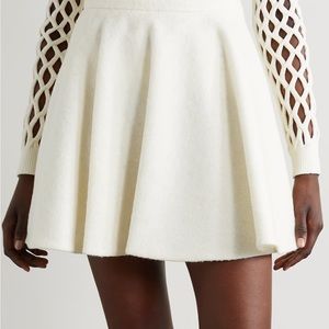 VALENTINO
Pleated brushed wool-blend mini skirt IT 42 Ivory